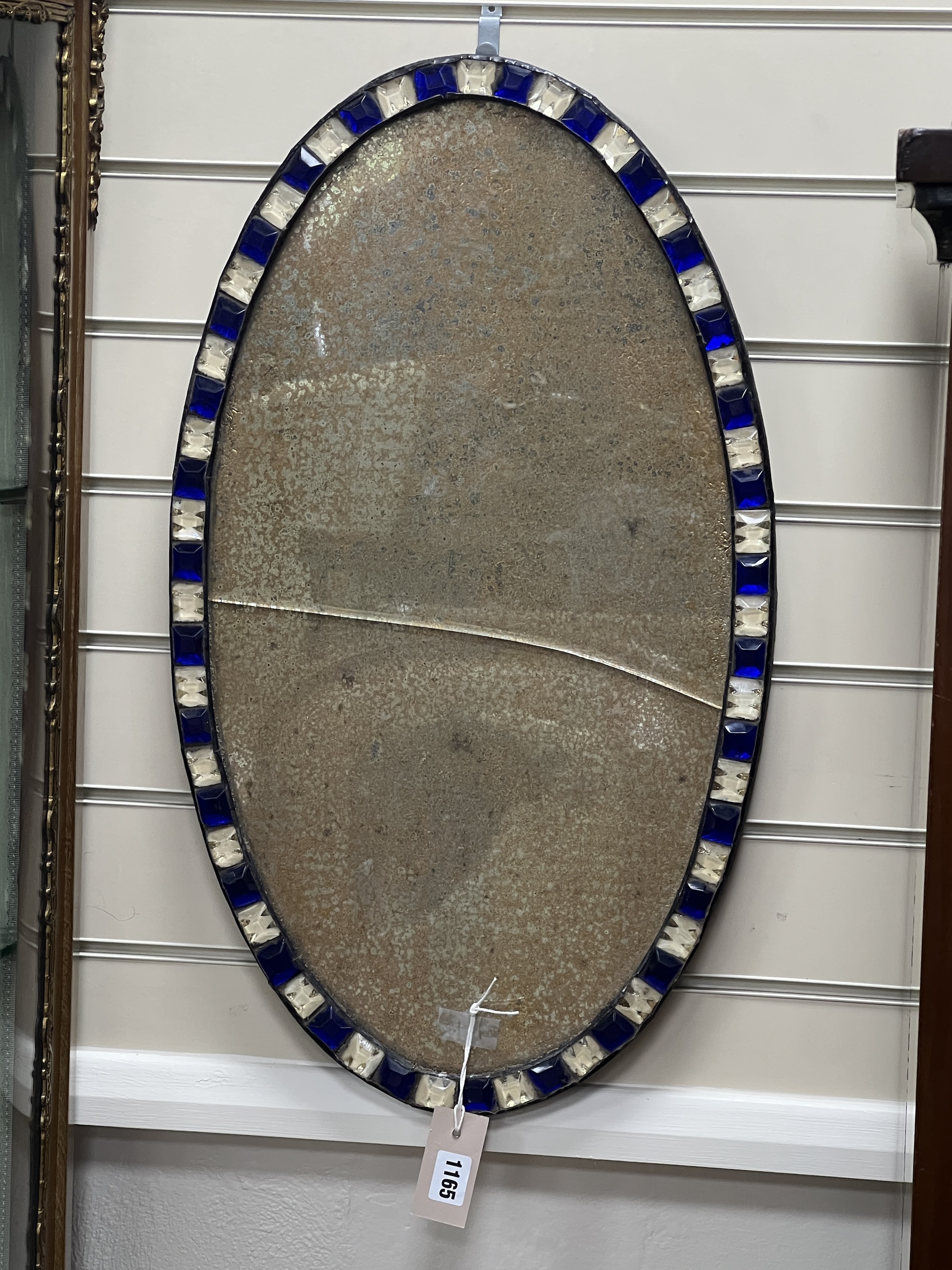 An Irish style oval wall mirror, width 38cm, height 66cm